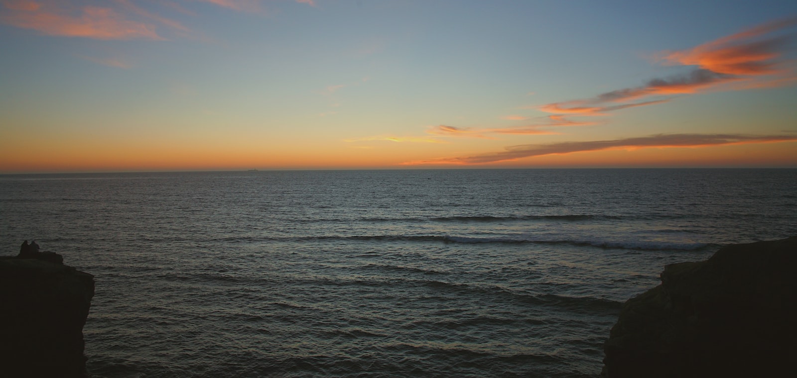 The low warm light of morning over the calm water of Hecate Strait